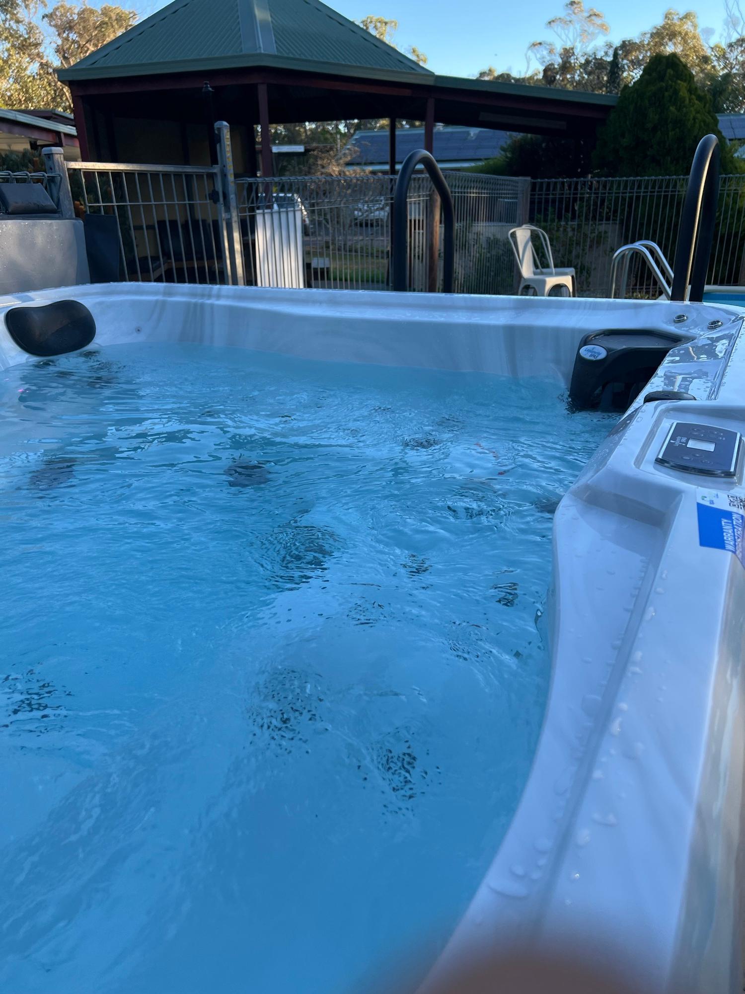 Close-up of warm, bubbling spa water with hydrotherapy jets at Sanctuary House Healesville